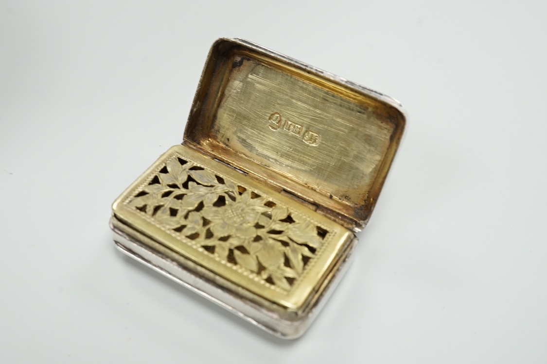 A late Victorian repousse silver navette shaped dish, by Charles Edwards, London, 1894, 25.7cm, with engraved monogram and date, together with a pair of mid 18th century silver sugar nips, an early 19th century silver vi
